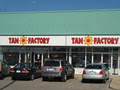 Tan Factory - Woodstock logo
