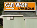 Fluff 'N Fold Laundromat and Car Wash logo