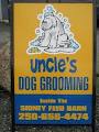 Uncle's Dog Grooming Salon logo