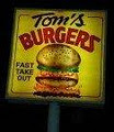 Tom's Burgers logo