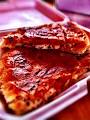 Tomaso Grilled Pizza & Panini logo