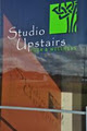 Studio Upstairs Yoga & Wellness logo